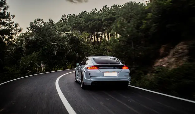 sport car with black white autotuning driving forest 114579 4076 2